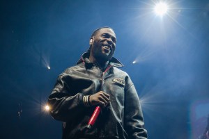 BERLIN, GERMANY - DECEMBER 09: Nigerian singer Damini Ogulu aka Burna Boy performs live on stage during a concert at the Mercedes-Benz Arena on December 9, 2023 in Berlin, Germany. (Photo by Frank Hoensch/Redferns)