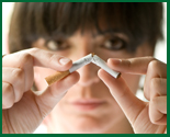 Woman breaking cigarette