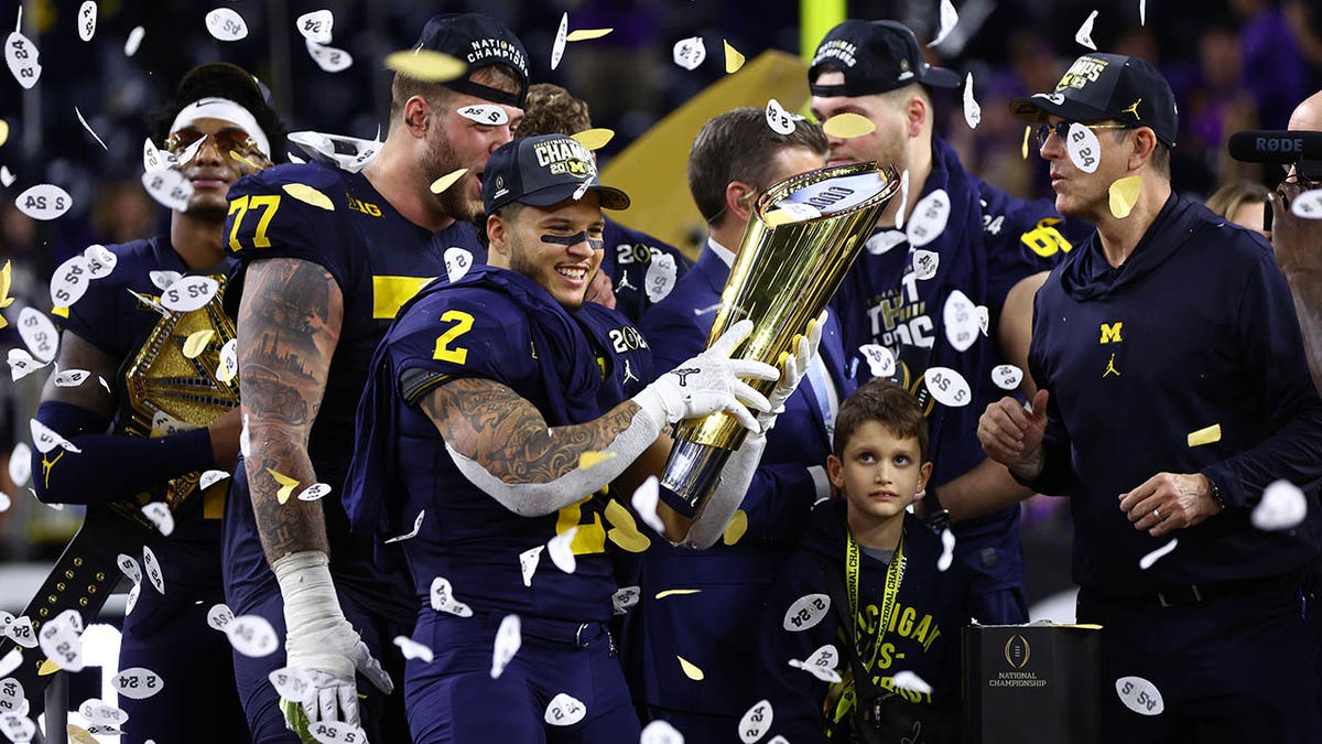 Blake Corum with championship trophy