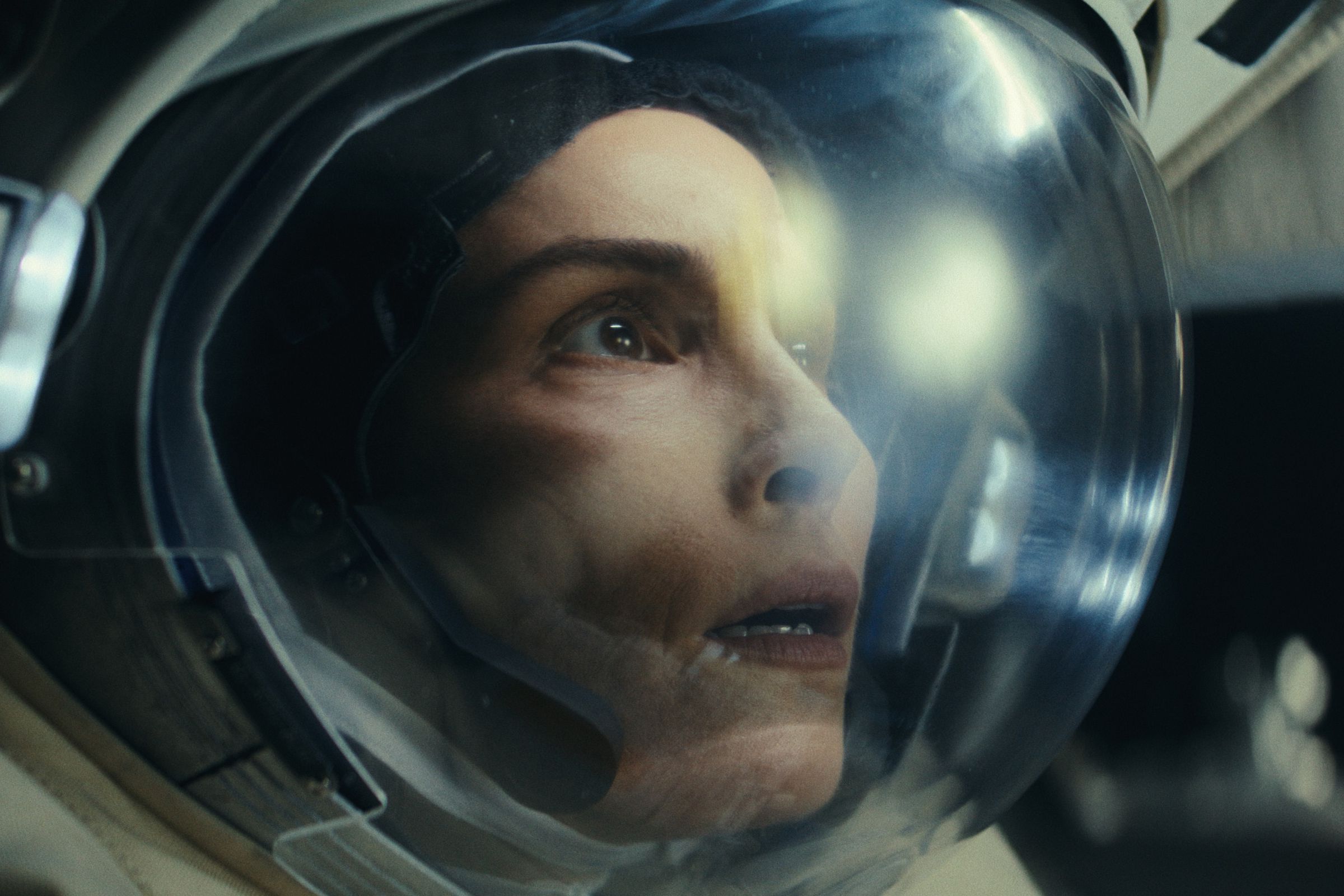 Picture of Noomi Rapace wearing an astronaut’s helmet, looking at something anxiously&nbsp;in a scene from the sci-fi TV series Constellation.