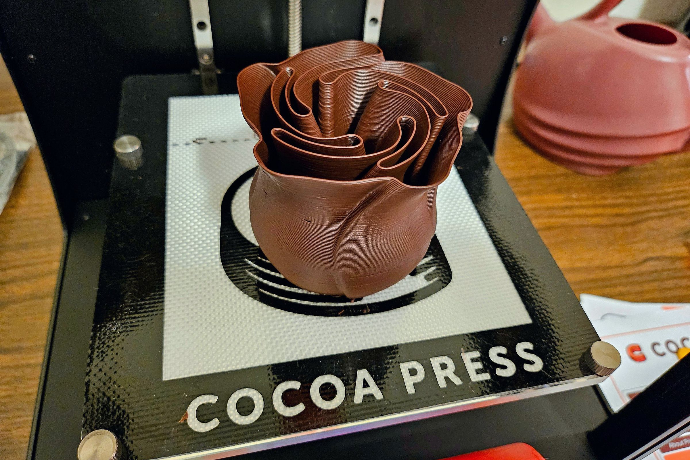 A chocolate rose printed on the Cocoa Press.