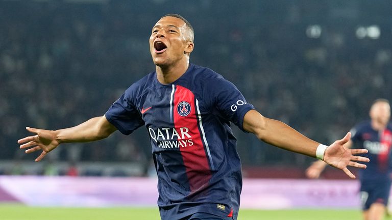 PSG's Kylian Mbappe celebrates his team's third goal during the French League One soccer match between Paris Saint-Germain and Lens at the Parc des Princes stadium in Paris, Saturday, Aug. 26, 2023. (AP Photo/Michel Euler)