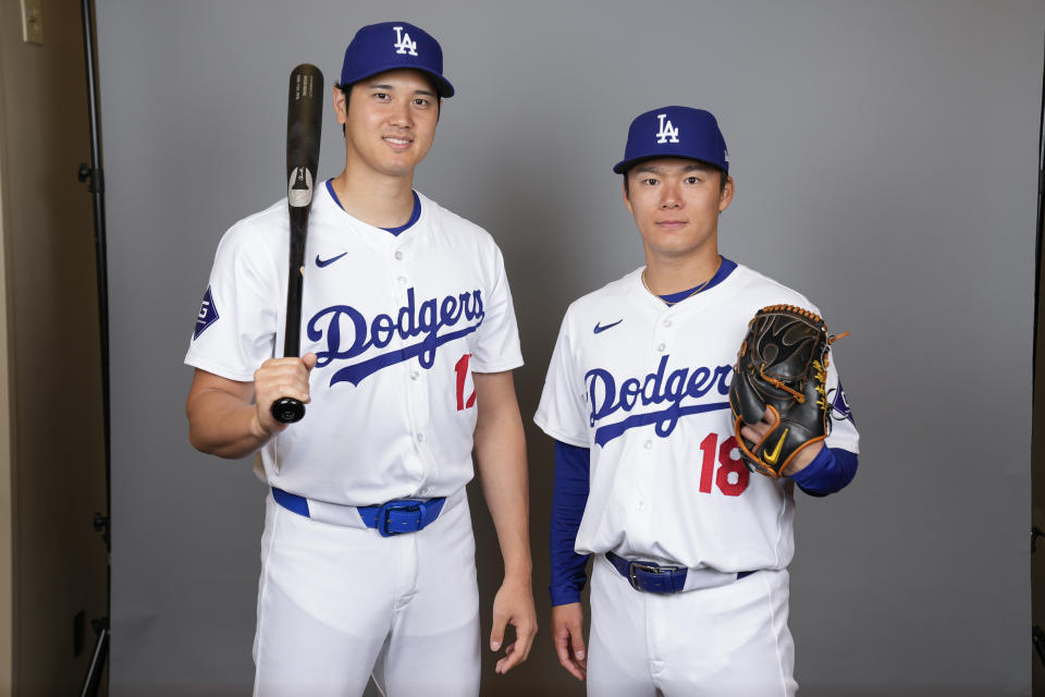 You probably shouldn't be able to see through Shohei Ohtani's and Yoshinobu Yamamoto's uniforms this much. (AP Photo/Ashley Landis)