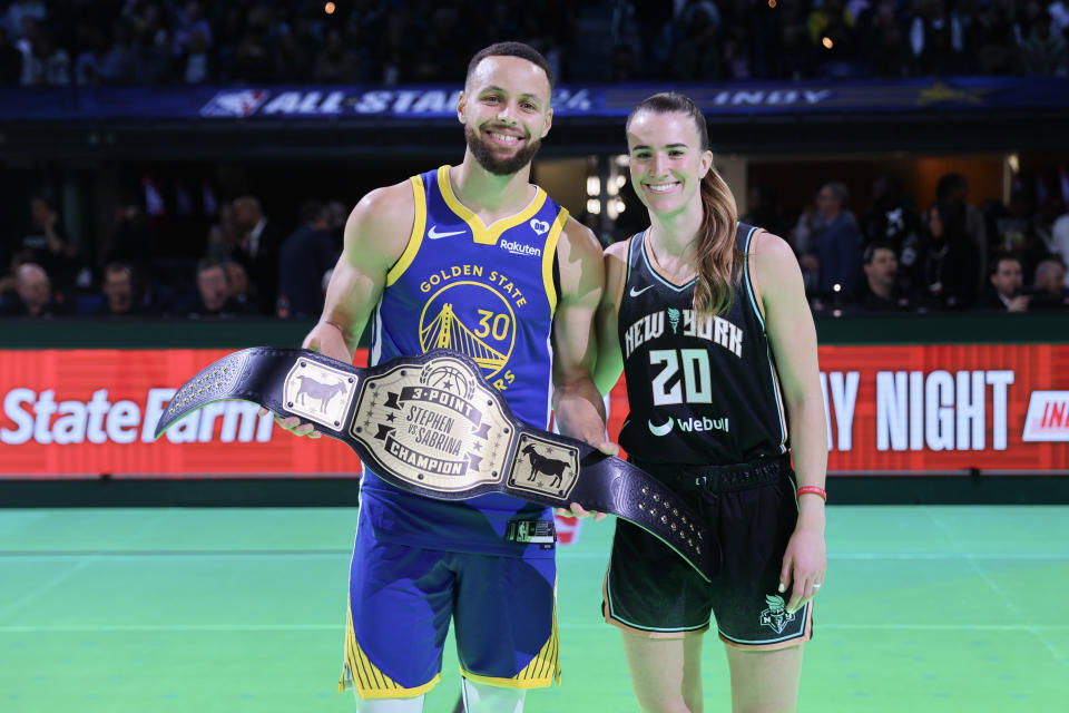 Stephen Curry and Sabrina Ionescu pose for a photo after their 3-point challenge during NBA All-Star festivities on Saturday in Indianapolis. (Photo by Stacy Revere/Getty Images)