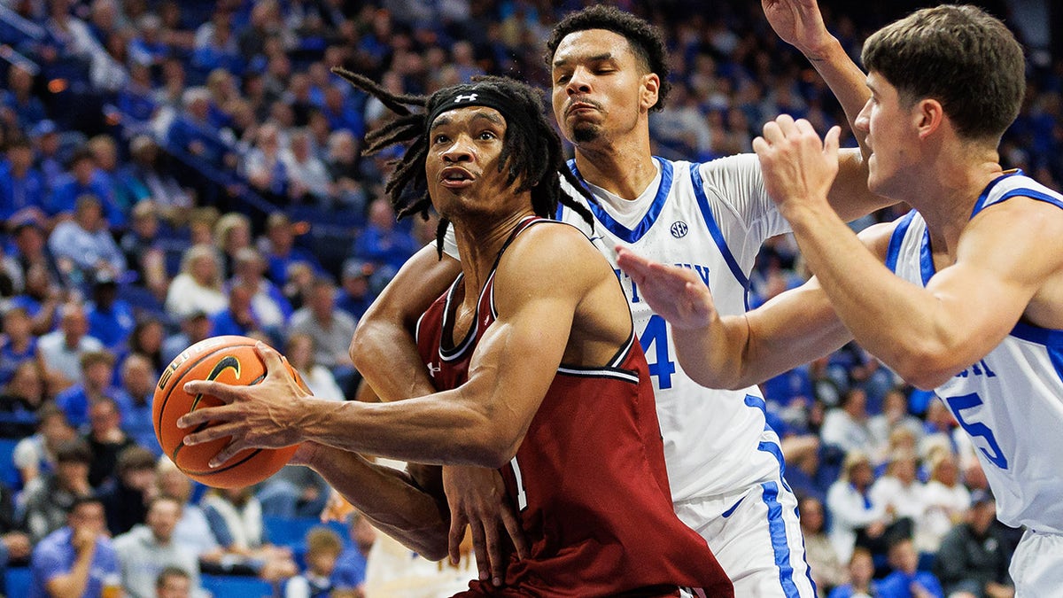 Robert Carpenter drives towards the basket