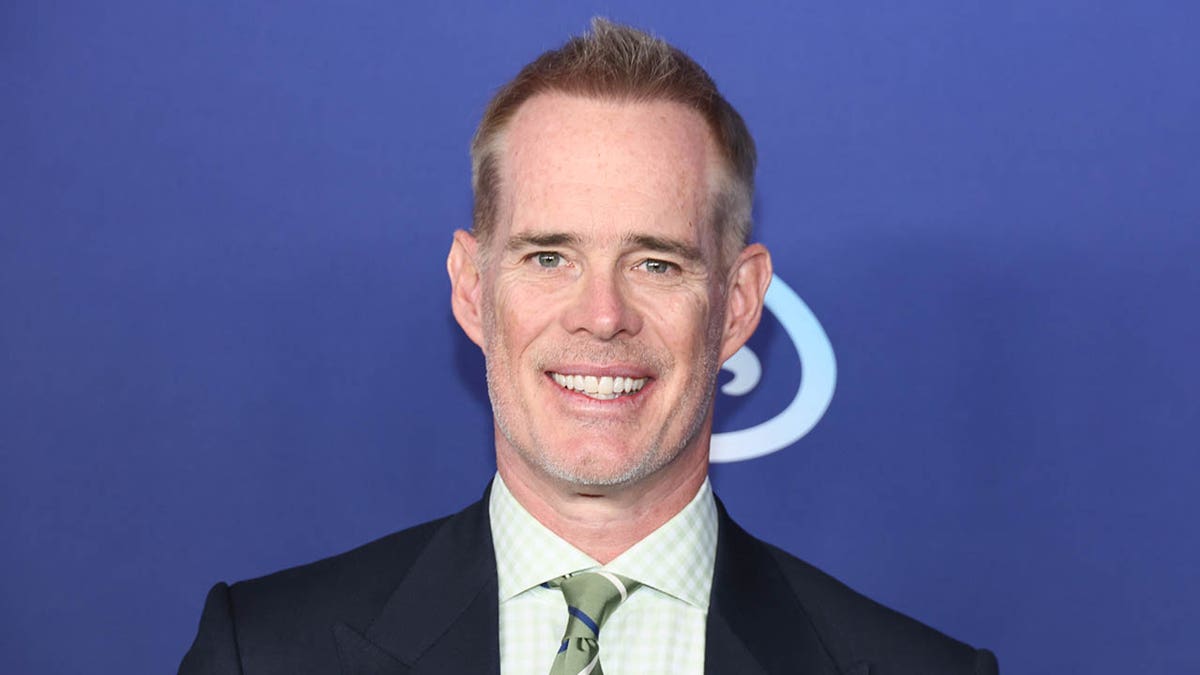 Joe Buck smiles on red carpet