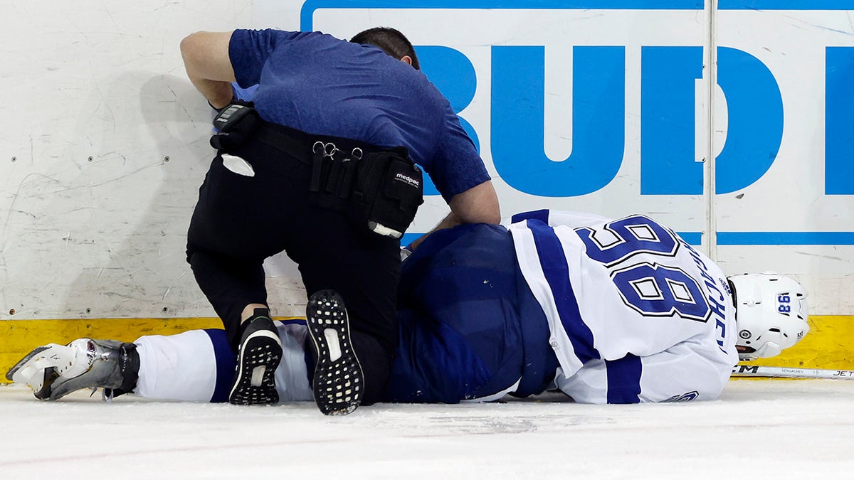 Mikhail Sergachev down on the ice