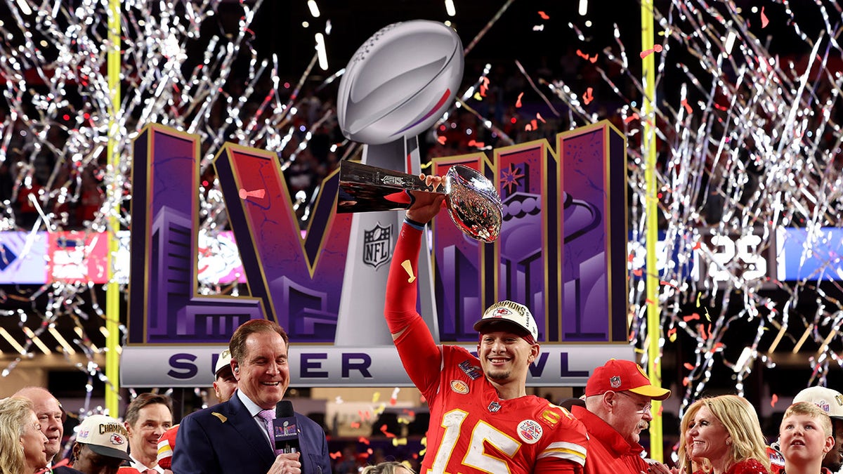 Chiefs player hoist the Lombardi Trophy