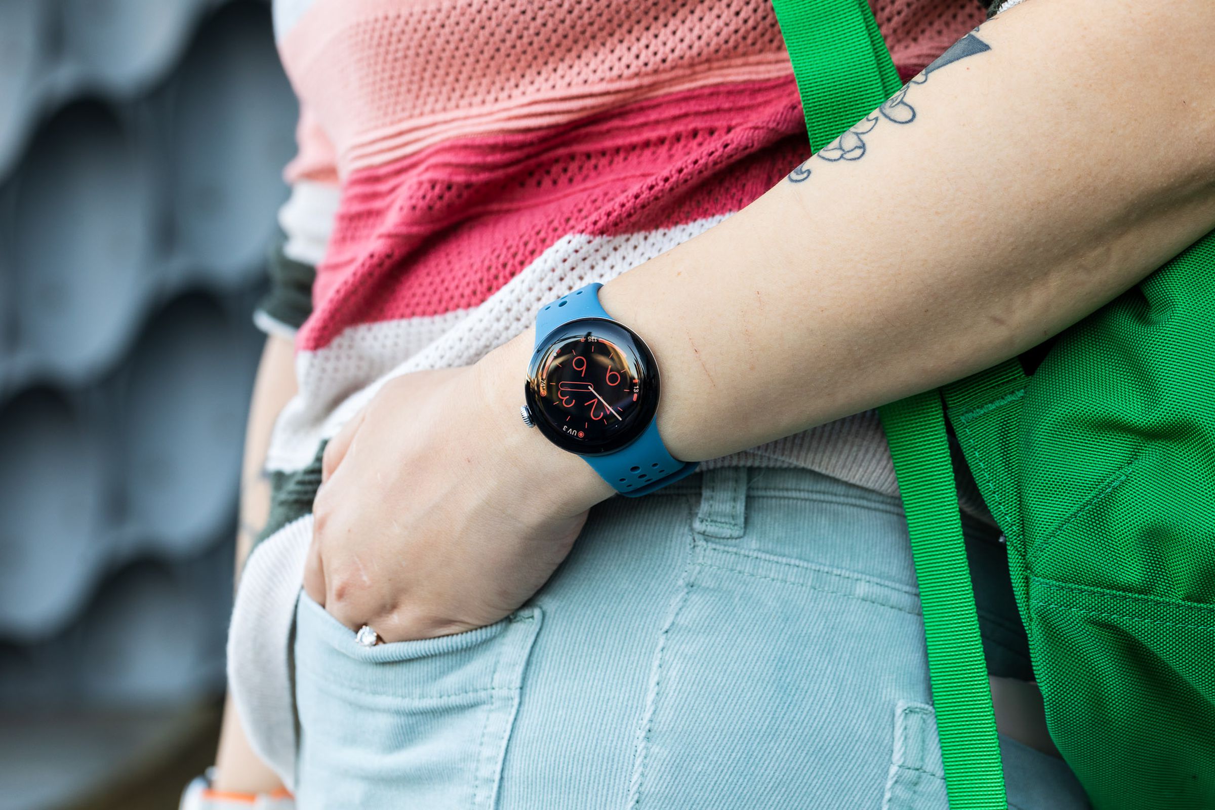 Person wearing Pixel Watch 2 while putting hand in pocket