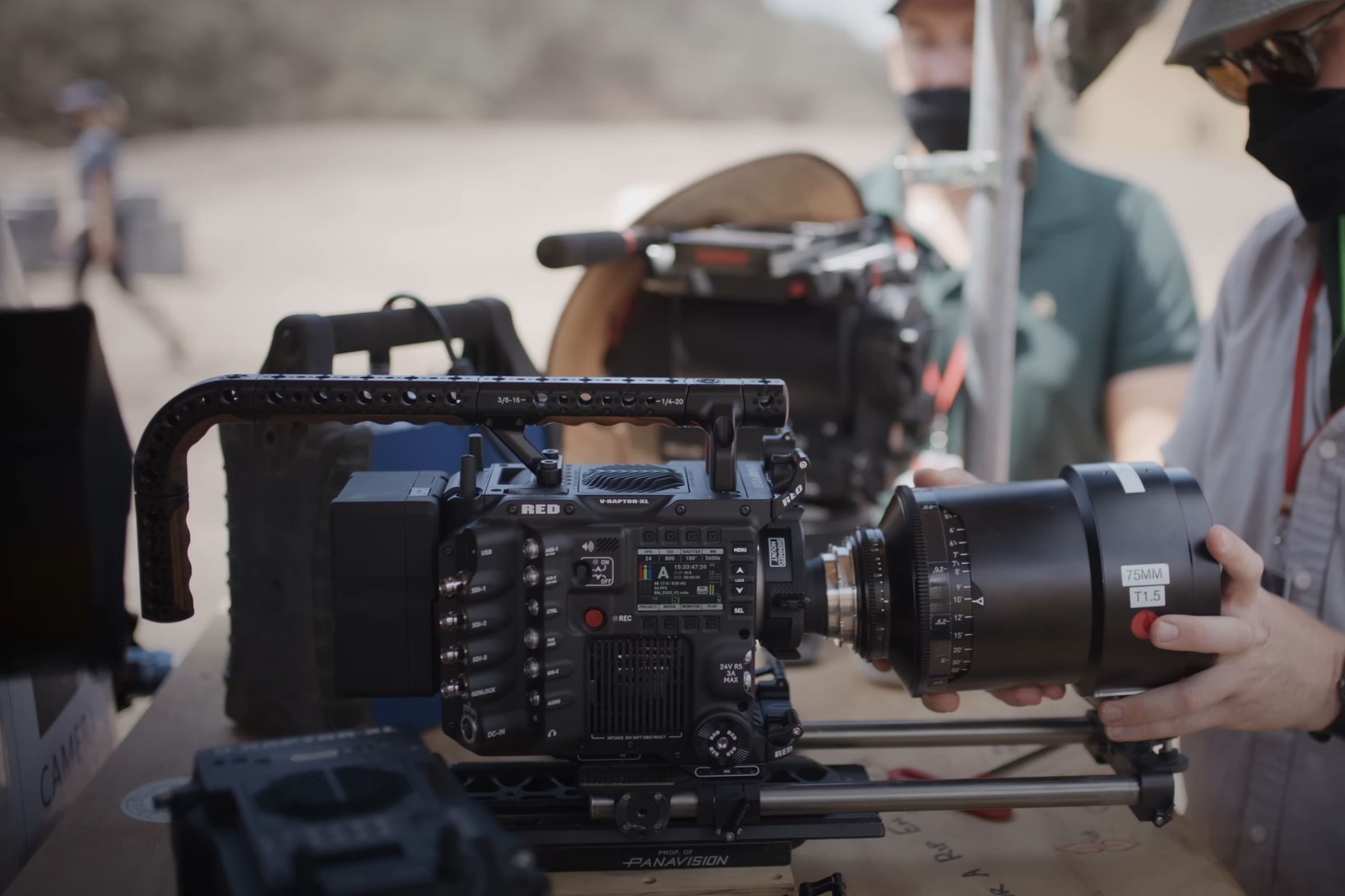 A RED V-Raptor XL camera having its lens replaced on a film set.