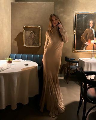 Rosie Huntington-Whiteley styles a beige high neck maxi dress