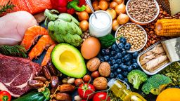 Overhead view of a large group of healthy raw food for flexitarian mediterranean diet. The composition includes salmon, chicken breast, canned tuna, cow steak,  fruits, vegetables, nuts, seeds, dairi products, olive oil, eggs and legumes. High resolution 42Mp studio digital capture taken with SONY A7rII and Zeiss Batis 40mm F2.0 CF lens