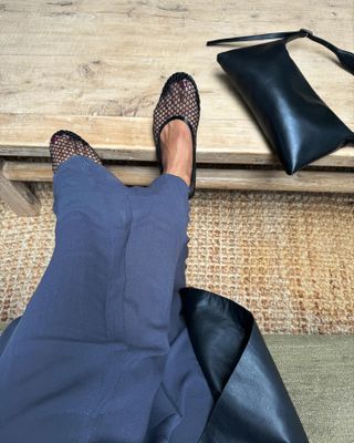 Influencer wears mesh flats from Mango.