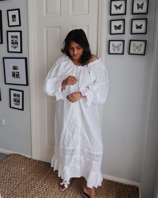 Influencer wears a white broderie anglaise dress