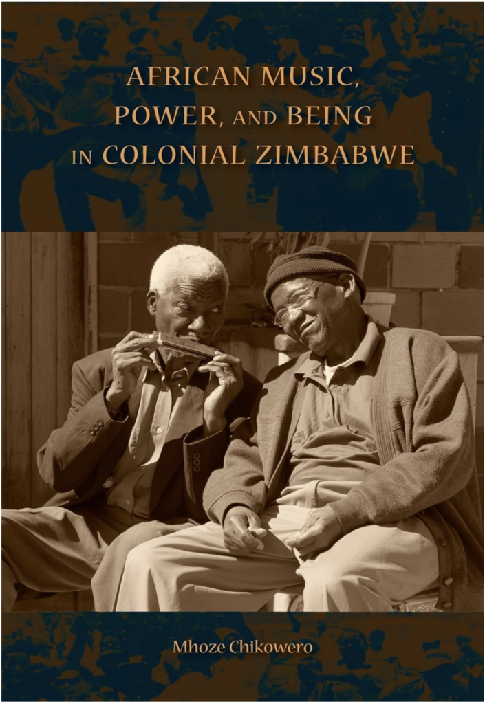 A book cover showing a sepia photograph of two older Black men, one playing a harmonica-like instrument