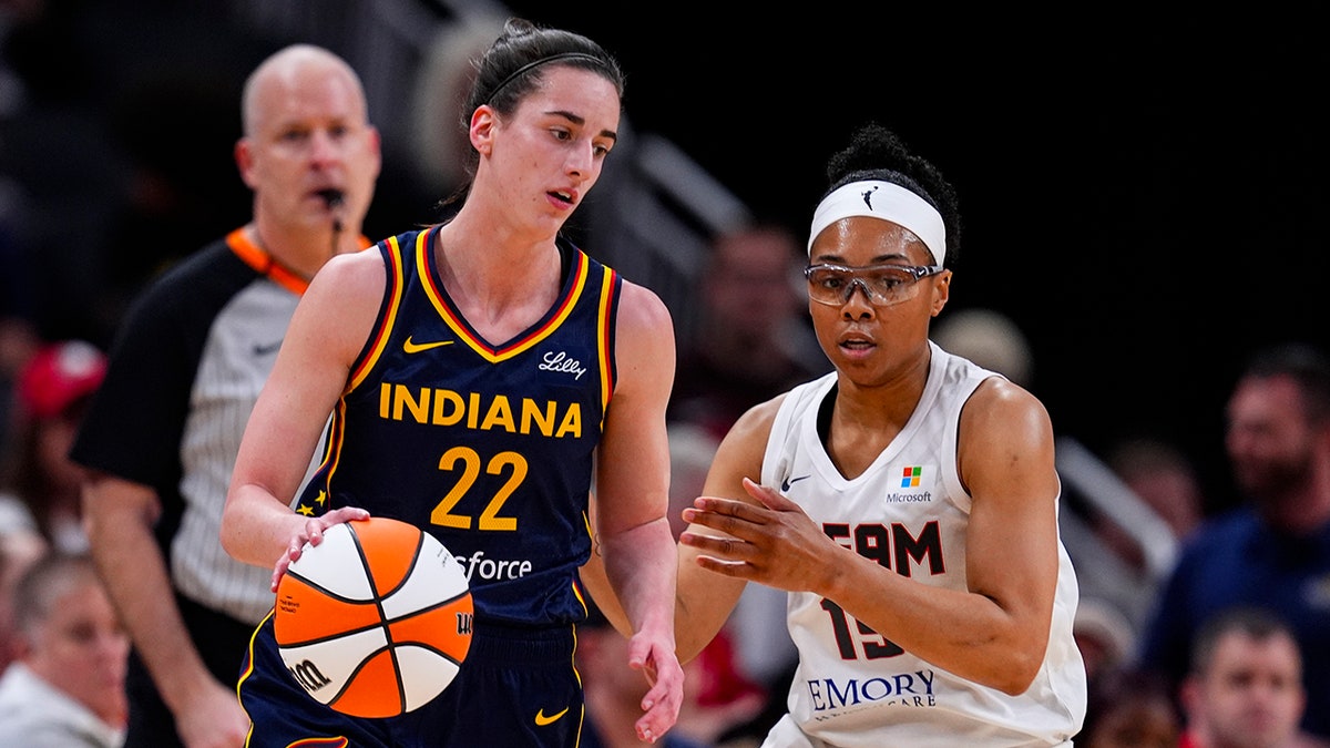 Caitlin Clark guarded by Allisha Gray