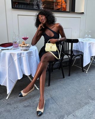 Emmanuelle Koffi wearing two-tone ballet pumps in Paris