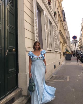 Influencer styles a light blue dress.