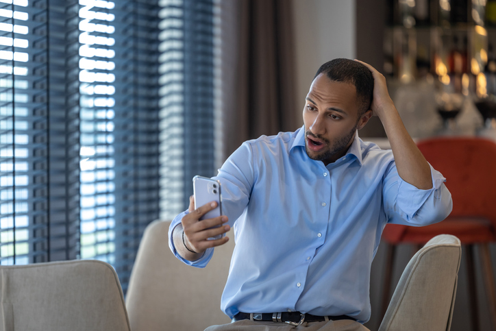 Businessman having online video communication in cafe while having break