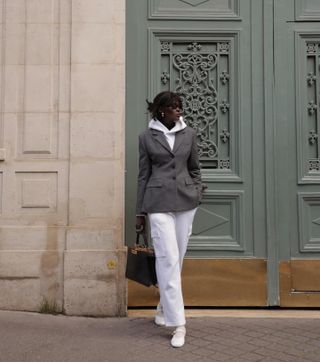 Amy Lefévre wearing a white sweatsuit with a gray hourglass Aritzia blazer