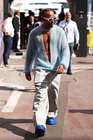 Sir Lewis Hamilton, Mercedes-AMG F1 Team, arrives in the paddock wearing custom Dior during previews ahead of the F1 Grand Prix of Monaco at Circuit de Monaco on May 23, 2024 in Monte Carlo, Monaco.