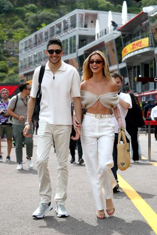 Esteban Ocon of France and Alpine F1 and Flavy Barla walk in the Paddock during previews ahead of the F1 Grand Prix of Monaco at Circuit de Monaco on May 23, 2024 in Monte-Carlo, Monaco.