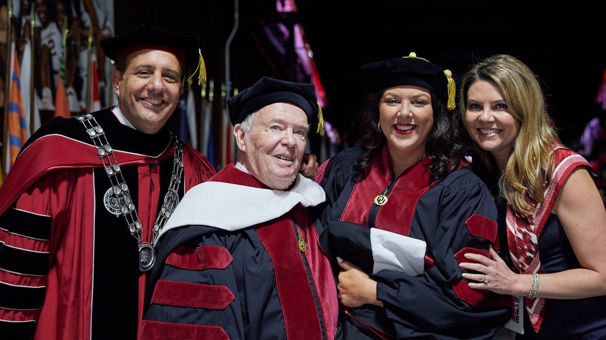 University of Oklahoma president Joseph Harroz Jr., David Proctor, Krystal Keith, and Ashley Harroz backstage at the University of Oklahoma commencement ceremony