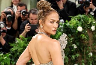 Jennifer Lopez at the 2024 Met Gala wearing a sheer Schiaparelli gown