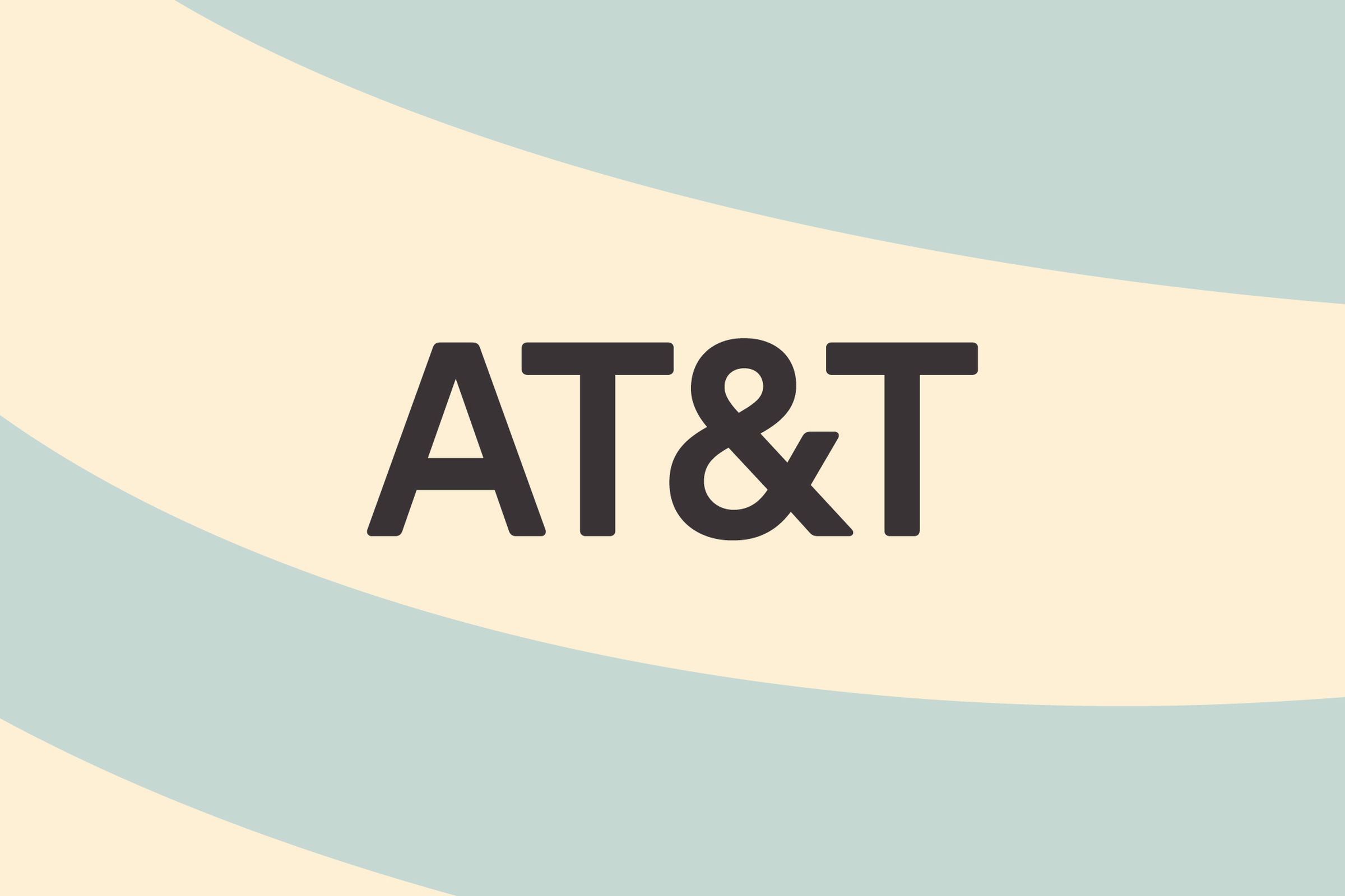 The text AT&amp;T logo on a light blue and tan background