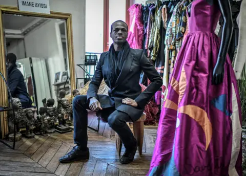 AFP Cameroonian fashion designer Imane Ayissi poses during a photo session at his workshop in Paris - 2020