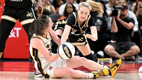 Getty Images Caitlin Clark fights for the ball in the fourth quarter during the Indiana Fever's game against the Washington Mystics on Friday.