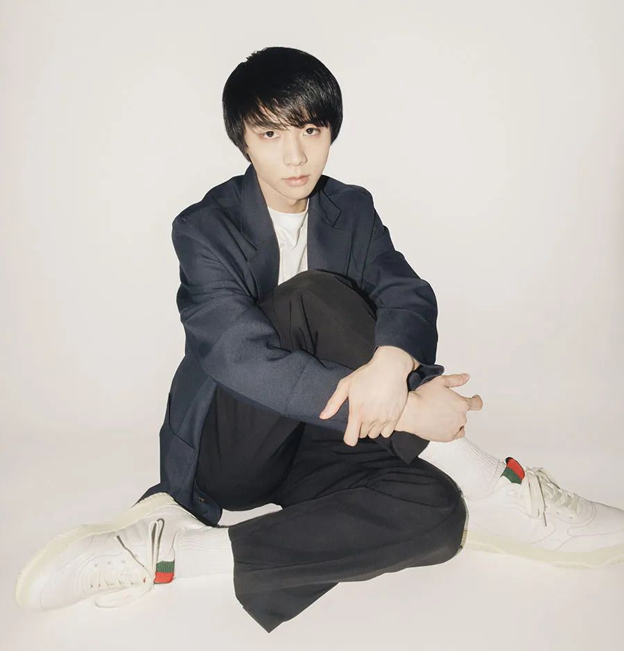 Yuzuru Hanyu appears at ease in a suit and sneaker outfit combo. Photo: Gucci