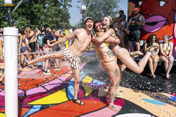 Festivalgoers are seen during the Bonnaroo Music & Arts Festival on Friday, June 14, 2024, in Manchester, Tenn. (Photo by Amy Harris/Invision/AP)