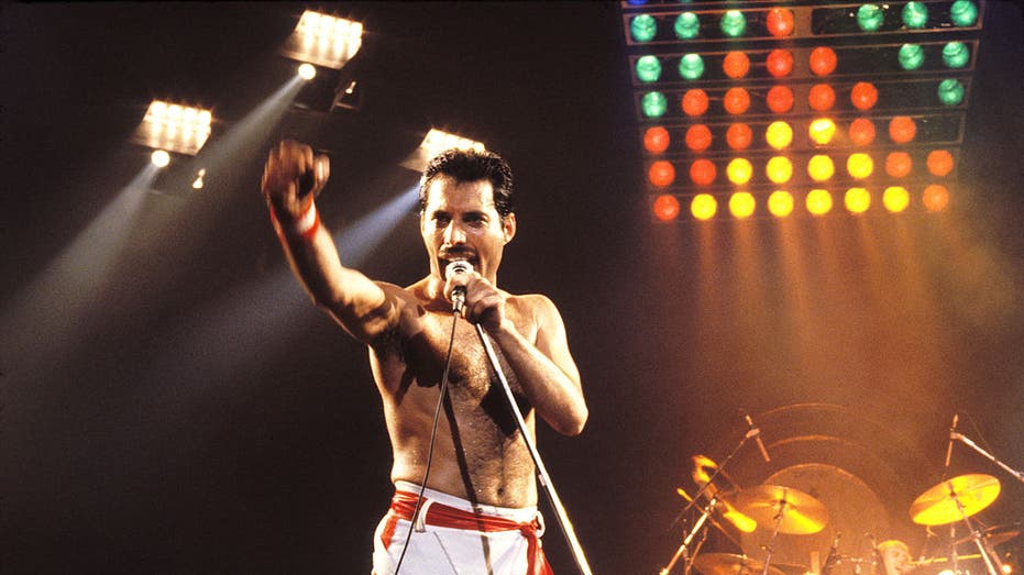 freddie mercury performing on stage during concert