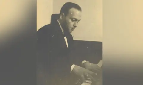 Family handout A black and white image of a musician at a piano