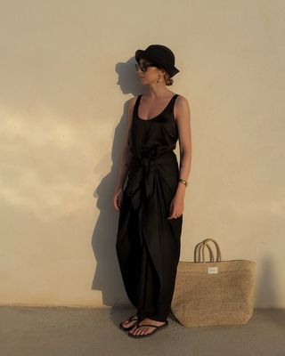 @brittanybathgate wearing Sleeper flip flops with black linen trousers