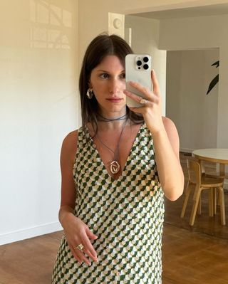 @laurareiley___ wearing green printed tank dress and cord necklace with gold pendant