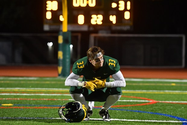 San Ramon Valley's Kevin Spears (33) takes a moment and watches his teammate celebrate after defeating Campolindo in overtime during their game at San Ramon Valley High School in Danville, Calif., on Friday, Nov. 10, 2023. San Ramon Valley defeated Campolindo in overtime 38-31. (Jose Carlos Fajardo/Bay Area News Group)