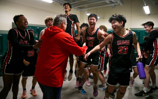 PALO ALTO - The Gunn locker room is jubilant after the victory. Gunn played Palo Alto in a high school basketball game on Feb. 3, 2024 at Palo Alto High School in Palo Alto, Calif. (Joseph Dycus/Bay Area News Group)