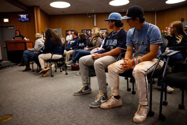 Supporters of former Branham athletic director Landon Jacobs including Branham varsity baseball player Ryan Field, second from right, and Branham junior varsity baseball player Riley Rhoades, far right, listen to Lisa Jacobs, far left, speak in support of Landon Jacobs at the Campbell Union High School District board meeting in San Jose, Calif., on Thursday, April 4, 2024. Lisa Jacobs is Landon Jacobs' former wife. (Nhat V. Meyer/Bay Area News Group)