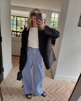 @emmarosethatcher wearing blue stripe linen trousers