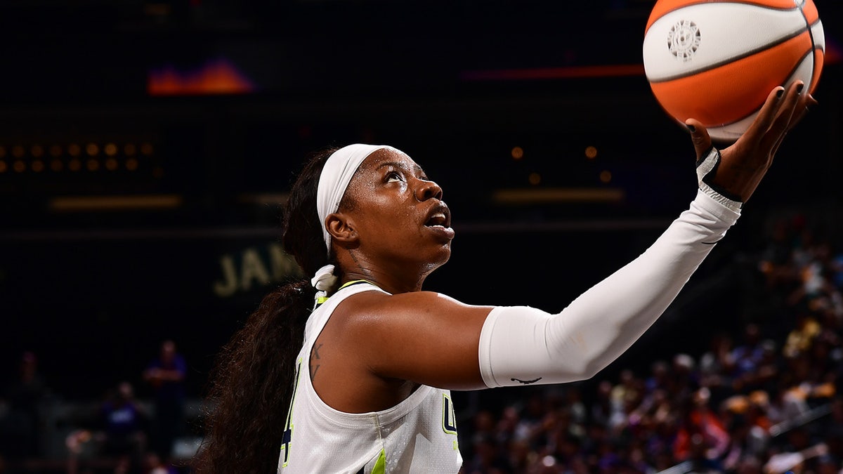 Arike Ogunbowale with the basketball 