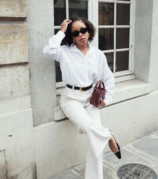 Woman in white shirt and pants.