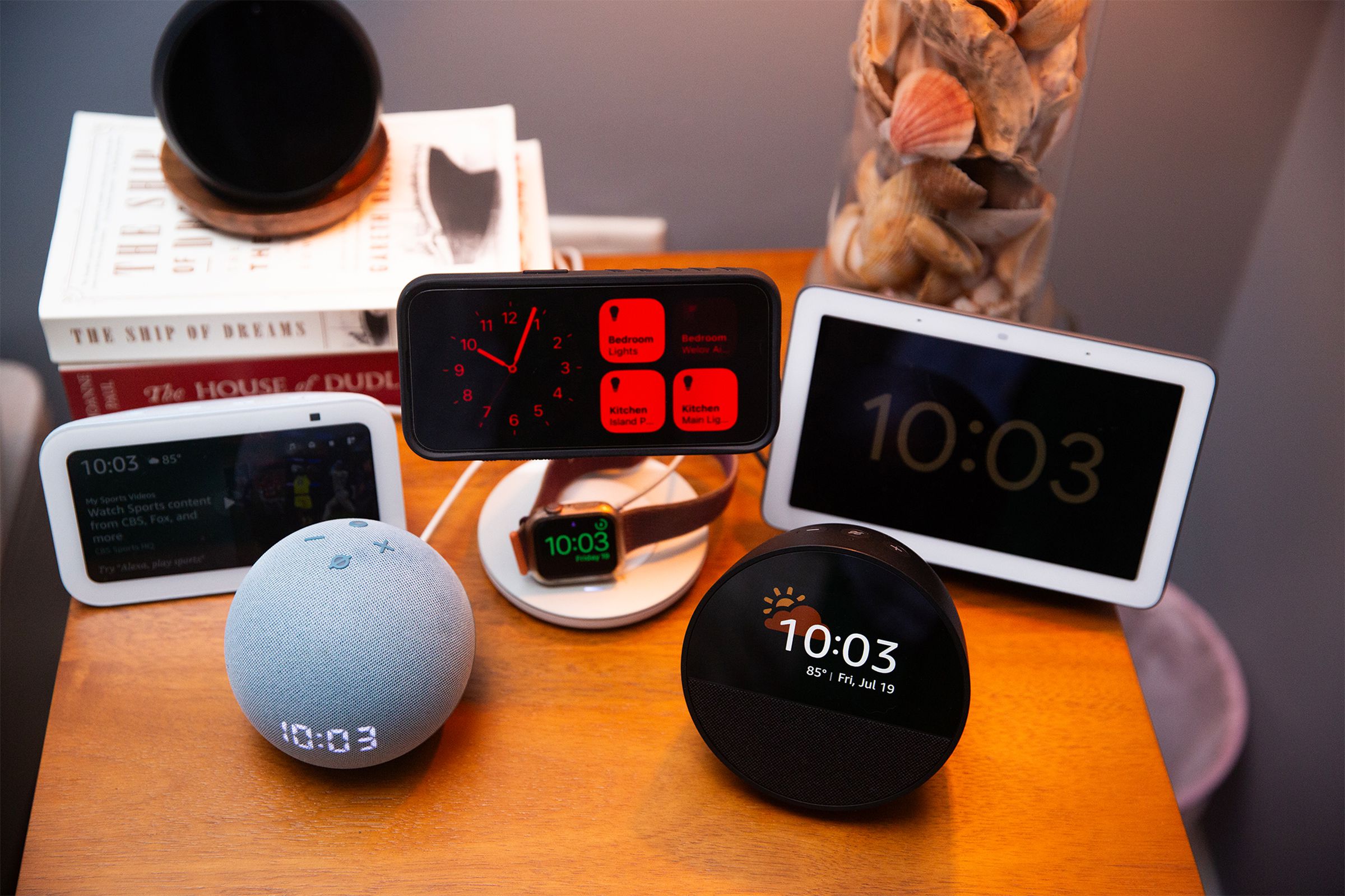 Photo of an Echo Spot sitting on a nightstand.