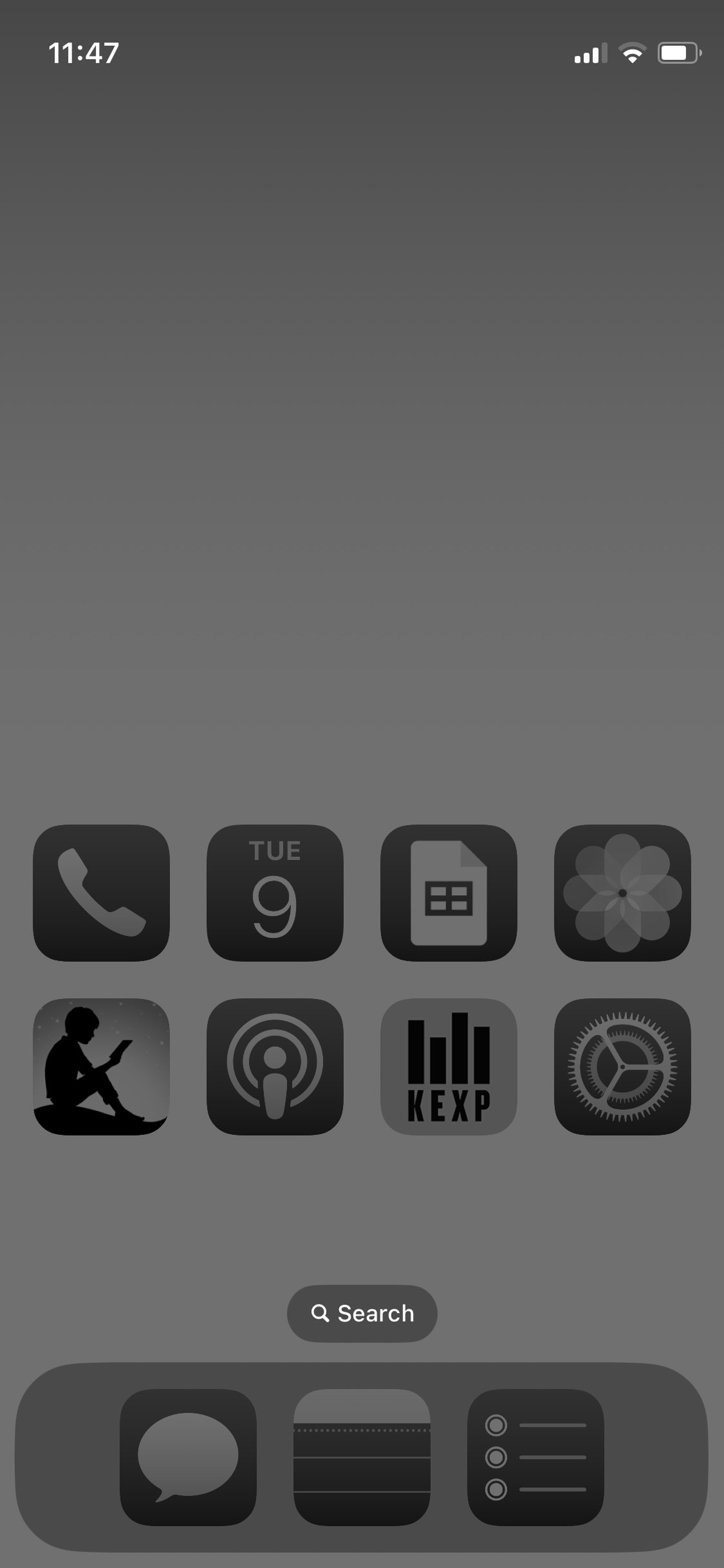 A gray iPhone homescreen with gray icons.