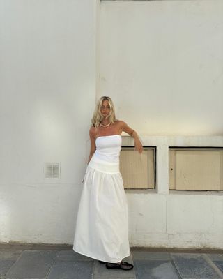 @josefinehj wearing a white poplin maxi skirt and tube top