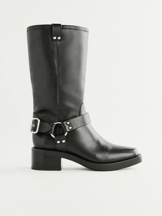 Black Moto Boots With a Silver Buckle