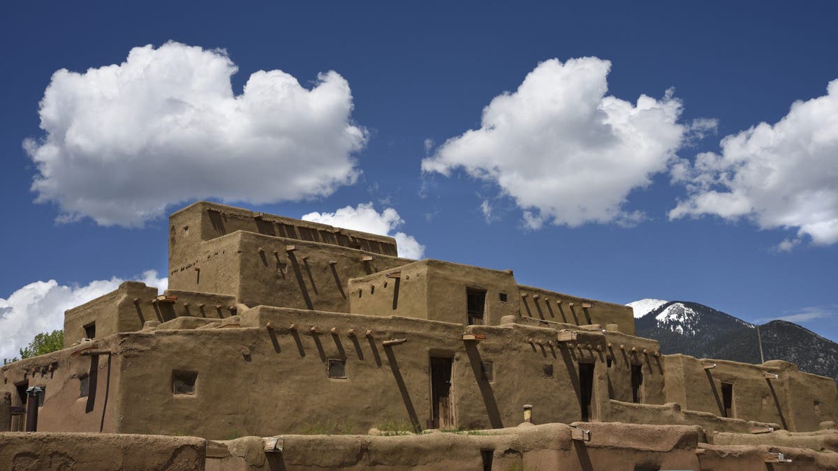 Taos Pueblos in New Mexico featuring a multi-story adobe complex