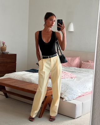 halter top + white pants — what women wear while shopping in europe