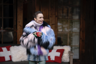 Lily Collins wears a furry jacket and a plaid skirt